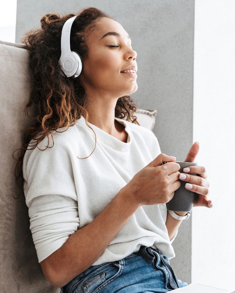 Young lady with headphones smiling